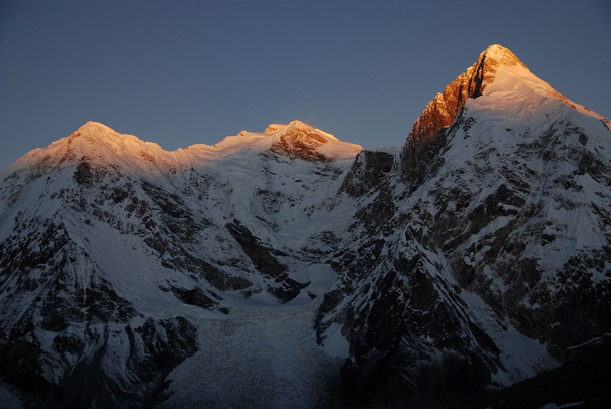 21 First Rays Of Sunrise On Pungpa Ri, Shishapangma East Face, Phola Gangchen From Kong Tso The first rays of sunrise silhouette Pungpa Ri, the Shishapangma East Face and Phola Gangchen from Kong Tso camp (5198m).